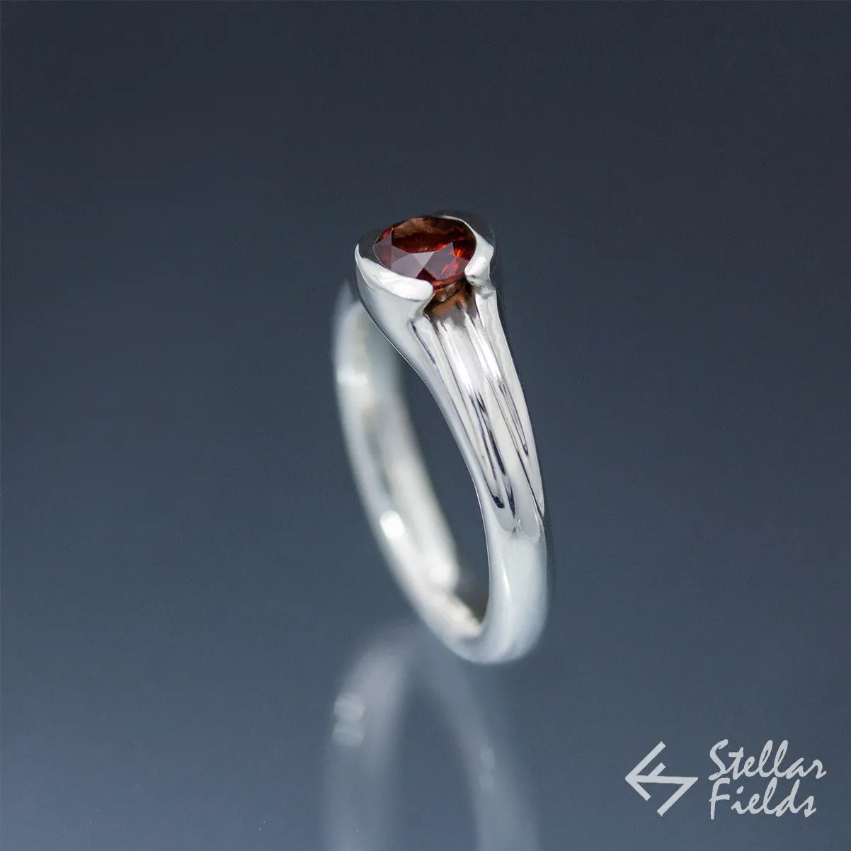 Tension Set Unique Round Red Garnet Ring