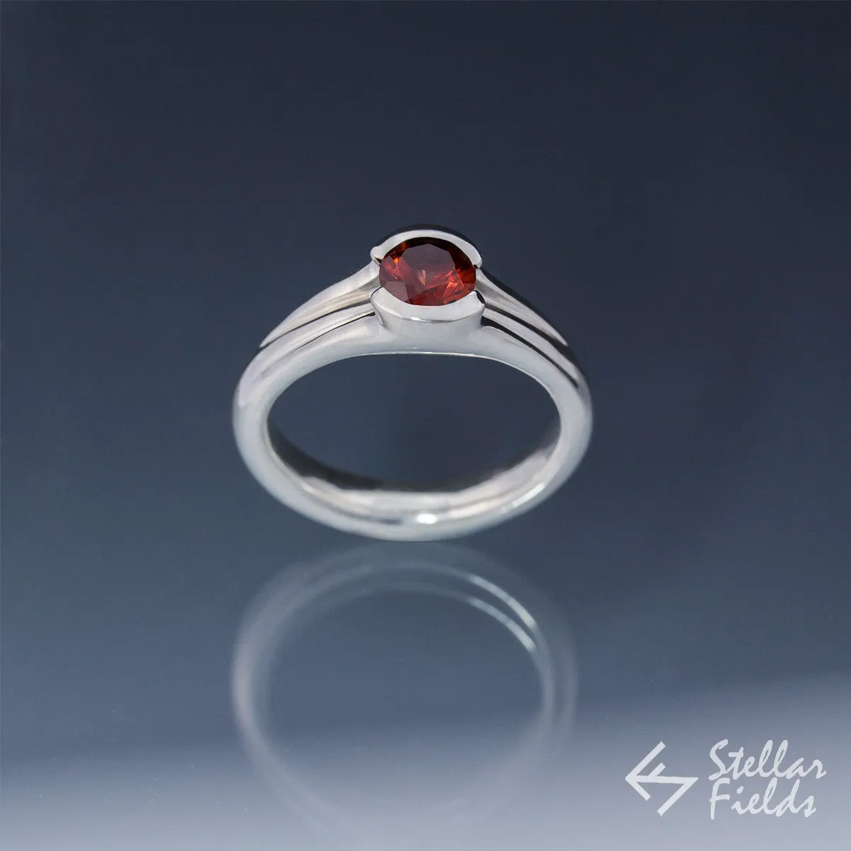 Tension Set Unique Round Red Garnet Ring