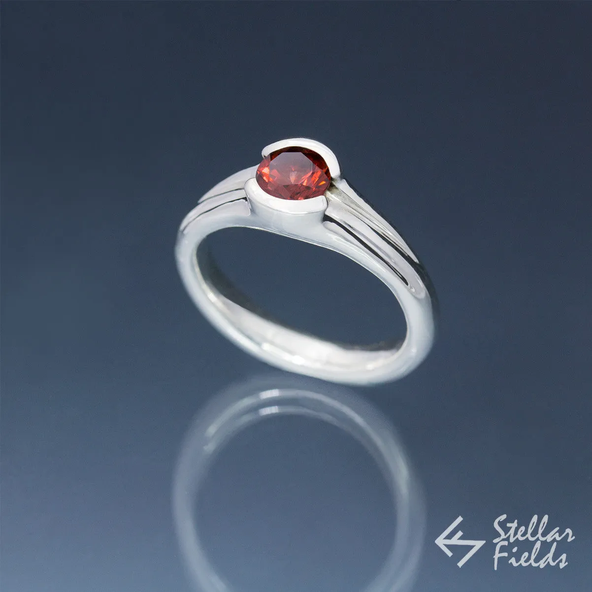 Tension Set Unique Round Red Garnet Ring